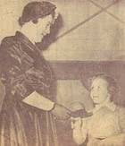 Florence Harbinson presenting scissors to Mrs W Moore before she unfurled the new banner